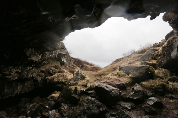 Exploring a cave at Þingvellir National Park in Iceland